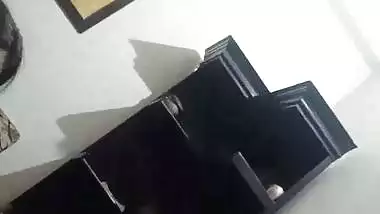 The lady gives a desi blowjob to the man on the couch